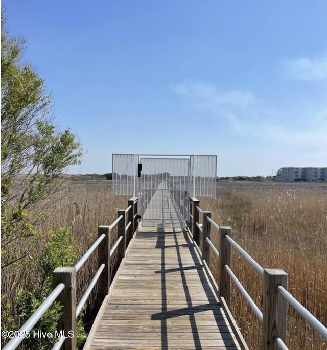 view of dock featuring a rural view