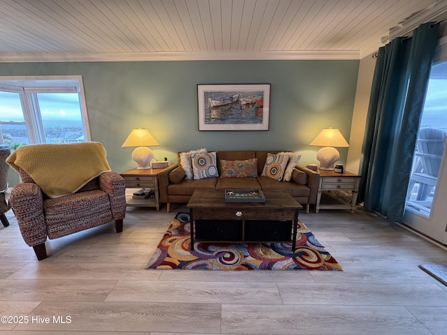 living room featuring crown molding, light hardwood / wood-style flooring, and wooden ceiling