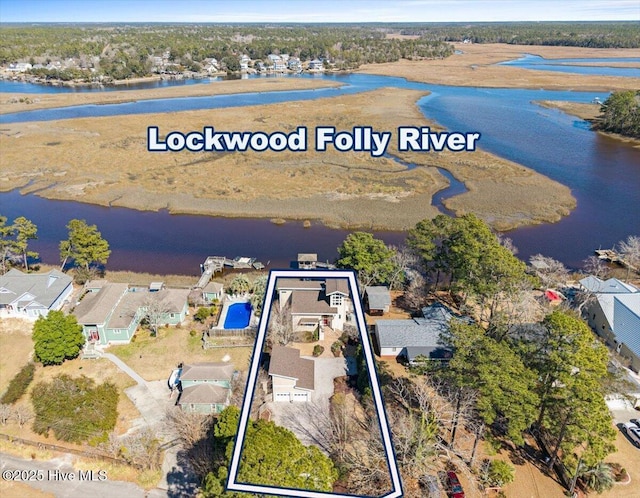 drone / aerial view featuring a water view and a residential view