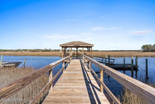 dock area featuring a water view and a gazebo