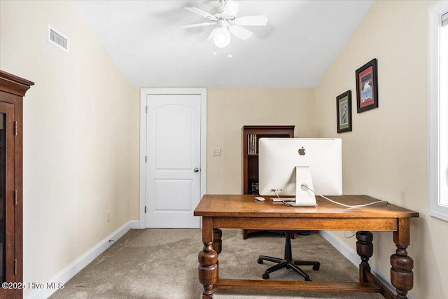 carpeted home office with visible vents, baseboards, and ceiling fan