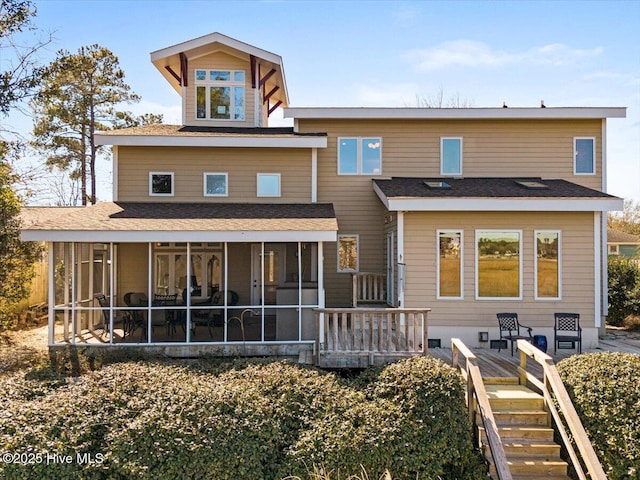 back of house with a sunroom, stairway, and a wooden deck