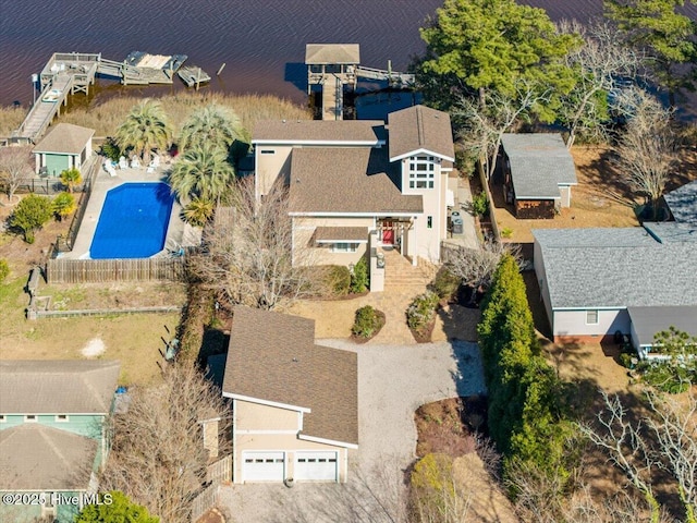 birds eye view of property with a water view