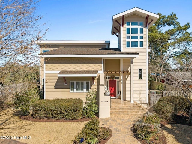 view of front of property featuring fence