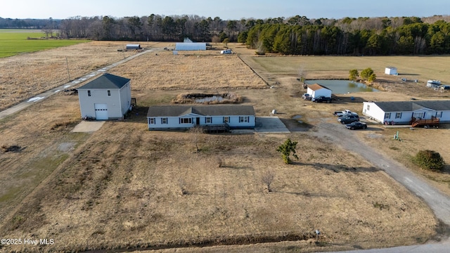 birds eye view of property featuring a rural view