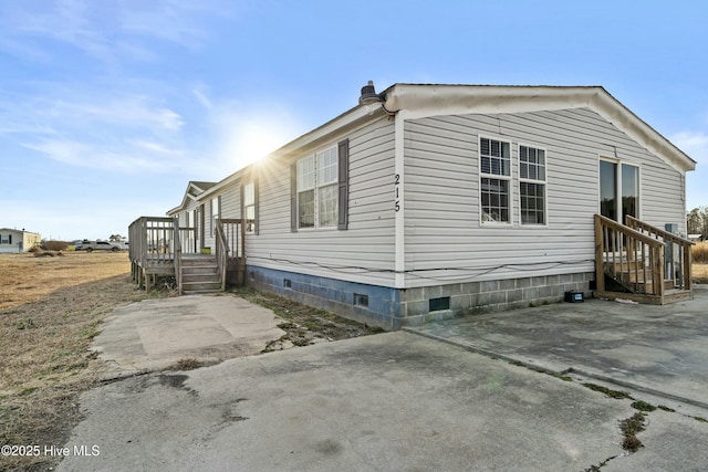 view of side of property with a patio area