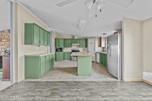 kitchen featuring crown molding, ceiling fan, stainless steel appliances, green cabinetry, and a kitchen island