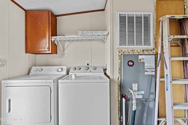 washroom with cabinets and independent washer and dryer