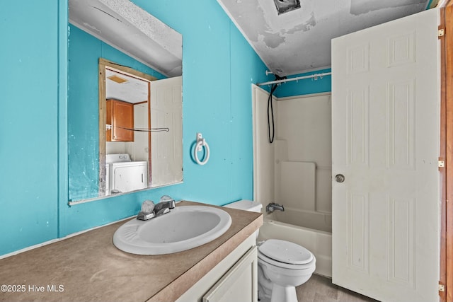 full bathroom with bathtub / shower combination, vanity, washer / clothes dryer, and toilet