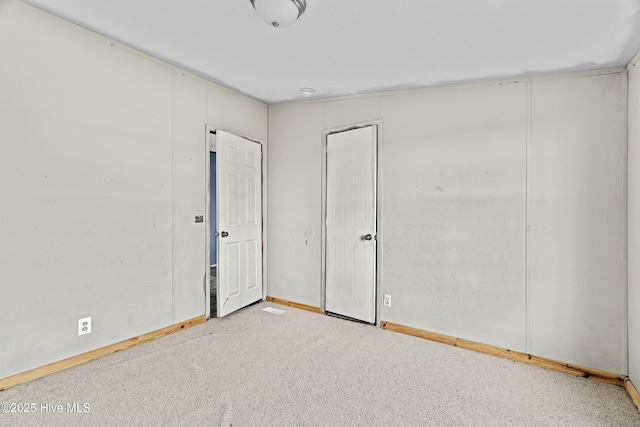 empty room with light colored carpet