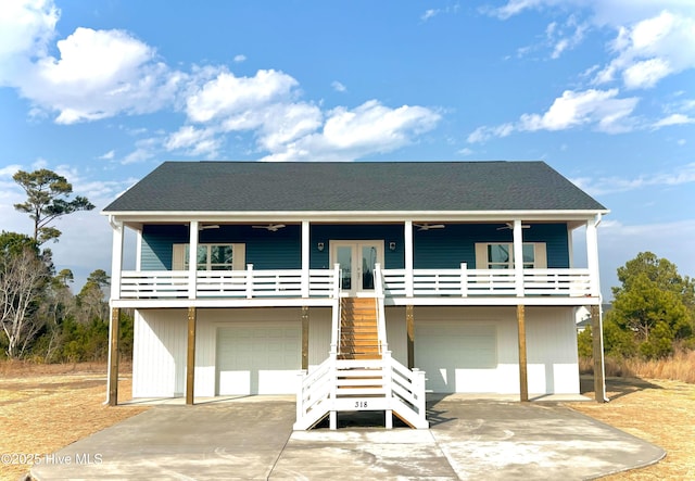 view of front of property featuring a garage and french doors