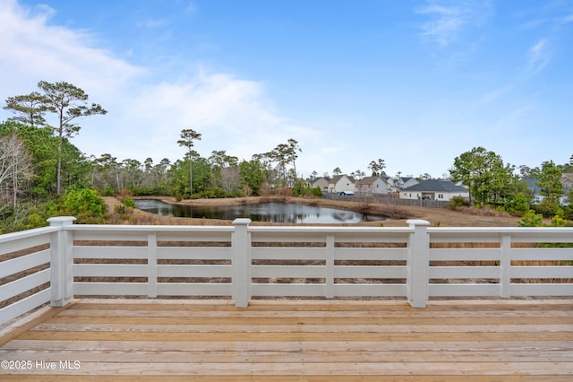 wooden deck with a water view