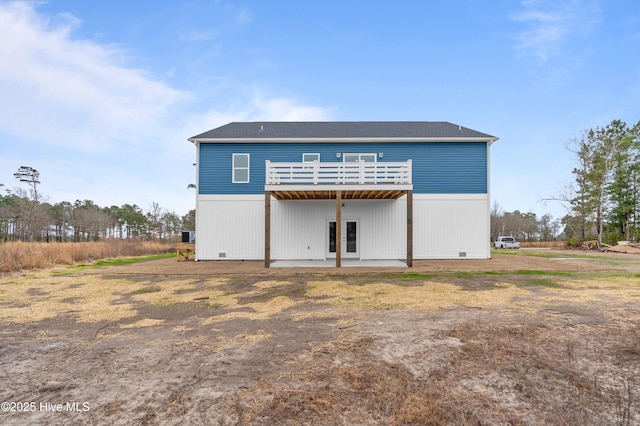 rear view of house with a deck, crawl space, and a patio area