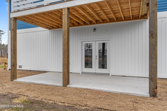 entrance to property with a patio and french doors