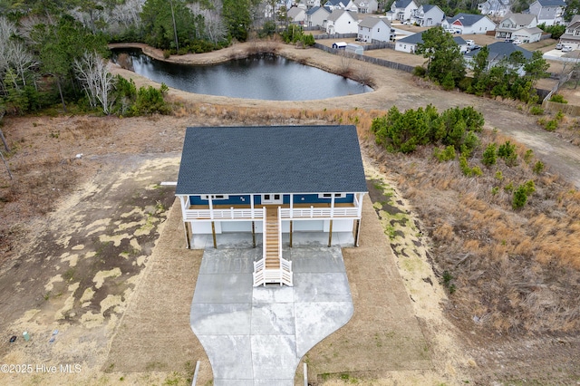 bird's eye view with a water view and a residential view