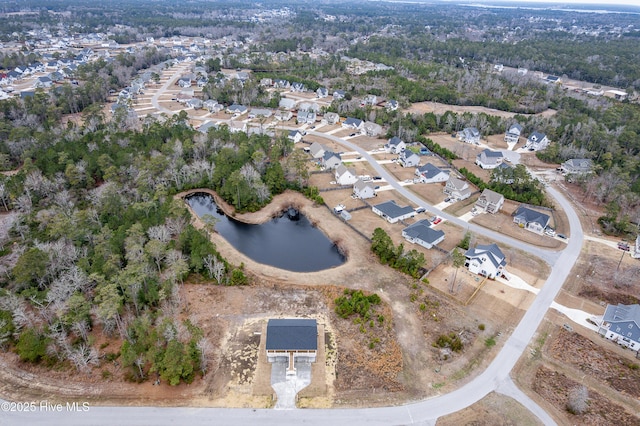 drone / aerial view featuring a water view and a residential view