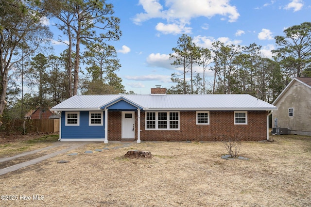 single story home featuring cooling unit