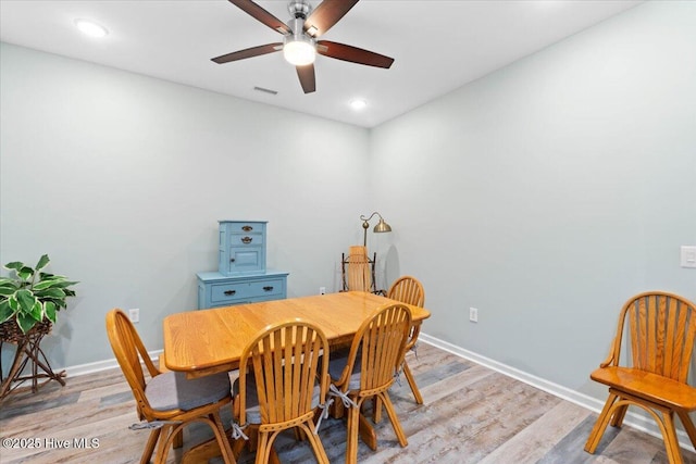 dining area featuring ceiling fan and light hardwood / wood-style flooring