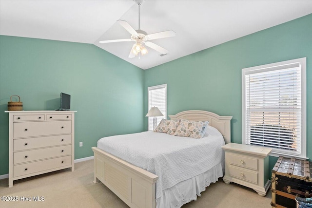 carpeted bedroom featuring vaulted ceiling and ceiling fan