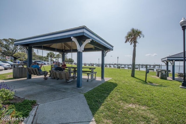 surrounding community featuring a yard, a gazebo, and a water view