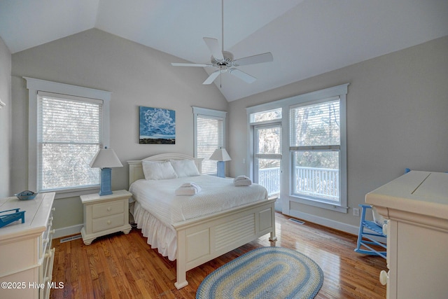 bedroom with ceiling fan, lofted ceiling, and light hardwood / wood-style floors