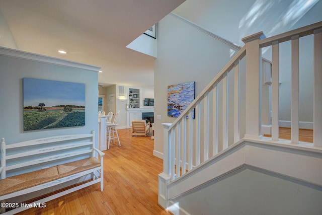 stairs featuring hardwood / wood-style flooring