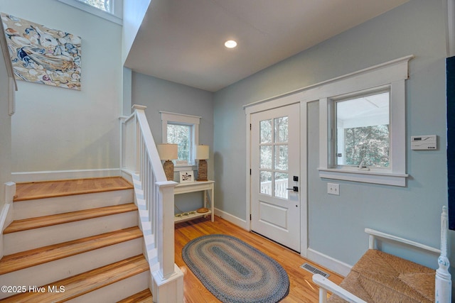 foyer entrance featuring hardwood / wood-style flooring