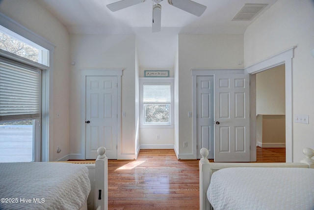 bedroom with ceiling fan and light hardwood / wood-style flooring