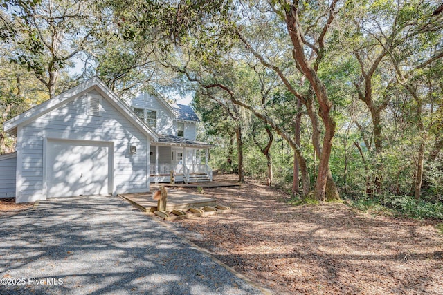 view of front of property featuring a garage and covered porch