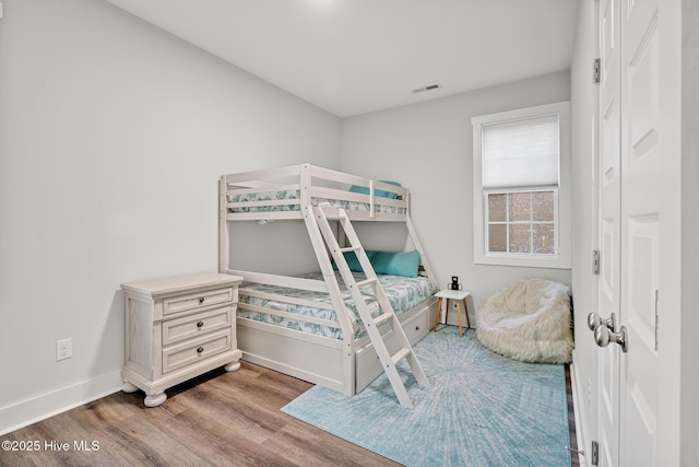 bedroom with wood-type flooring