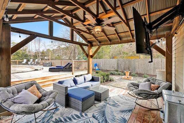 view of patio / terrace with a gazebo, an outdoor hangout area, ceiling fan, and a deck