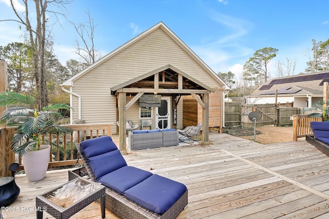 wooden deck with an outdoor living space