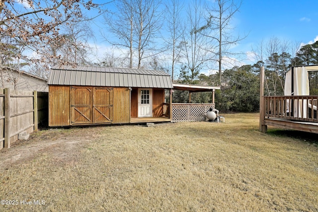 view of outbuilding with a yard