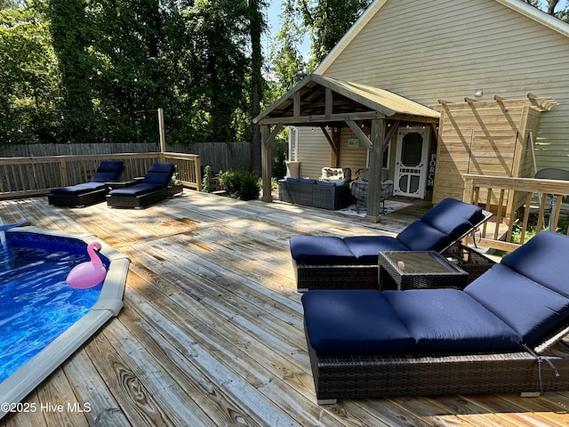 wooden deck featuring an outdoor living space