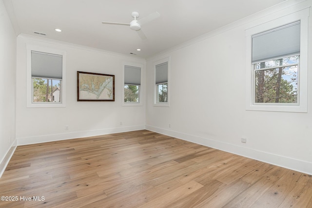 empty room featuring crown molding, ceiling fan, and light hardwood / wood-style flooring