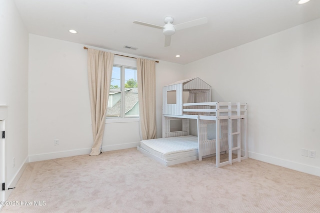 unfurnished bedroom with ceiling fan and carpet flooring