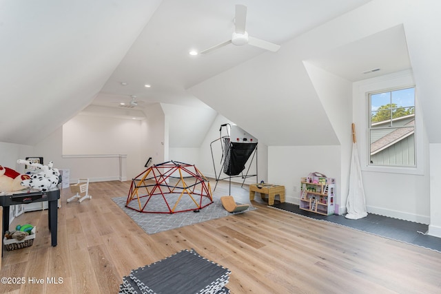 playroom with vaulted ceiling, hardwood / wood-style floors, and ceiling fan