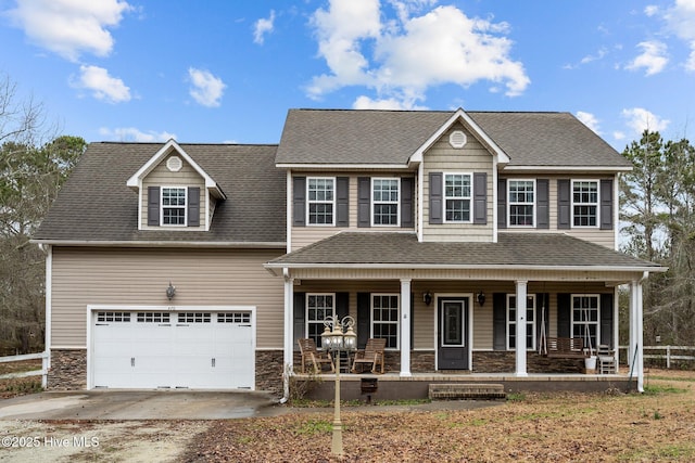 view of front of property featuring a garage and covered porch