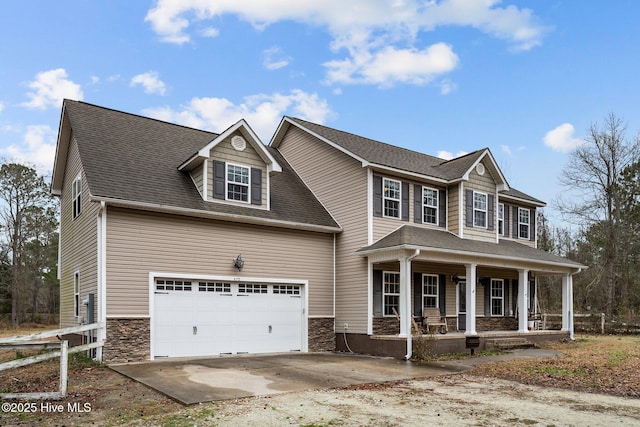 view of front of house featuring a garage and covered porch