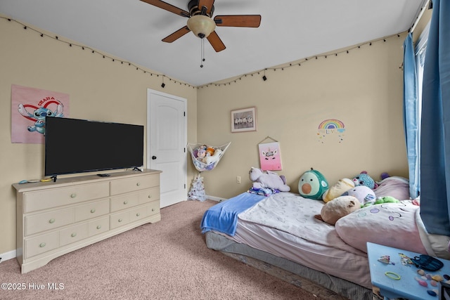 bedroom with ceiling fan and carpet flooring