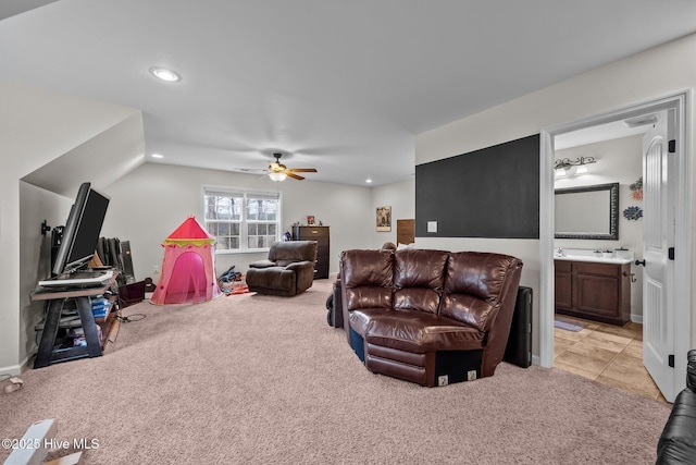 living room with ceiling fan and light colored carpet