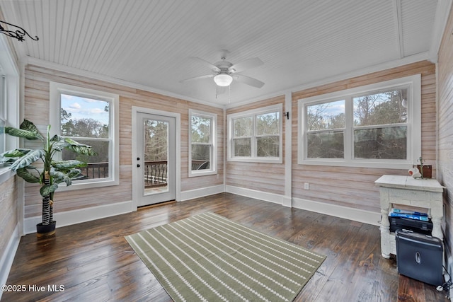 sunroom with ceiling fan and a healthy amount of sunlight