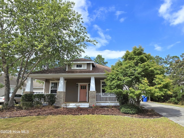 view of front of house featuring a front yard and a porch