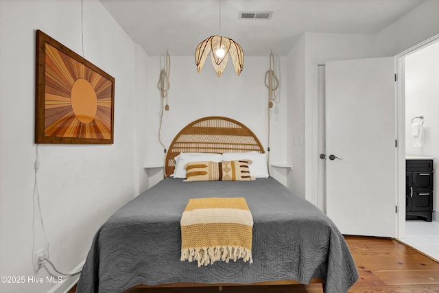 bedroom with light wood-type flooring