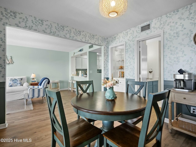 dining space featuring light hardwood / wood-style floors