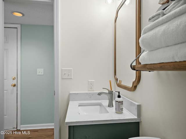 bathroom with vanity and hardwood / wood-style floors