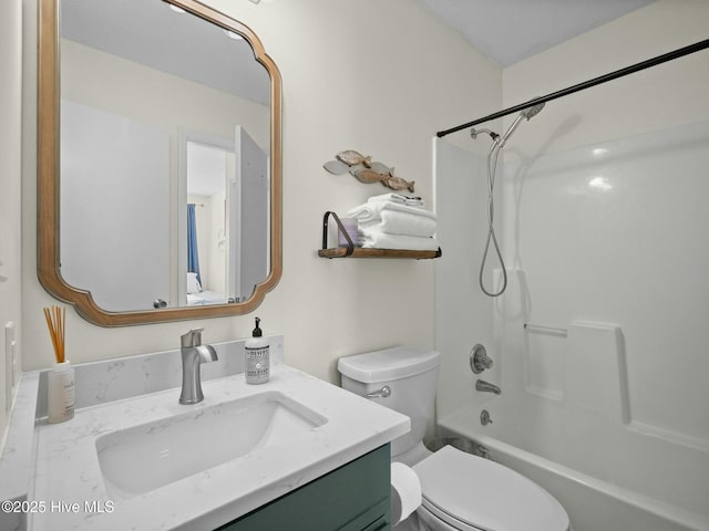 full bathroom with vanity, shower / bathtub combination, and toilet