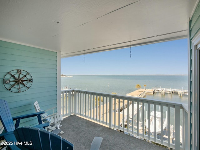 balcony featuring a water view