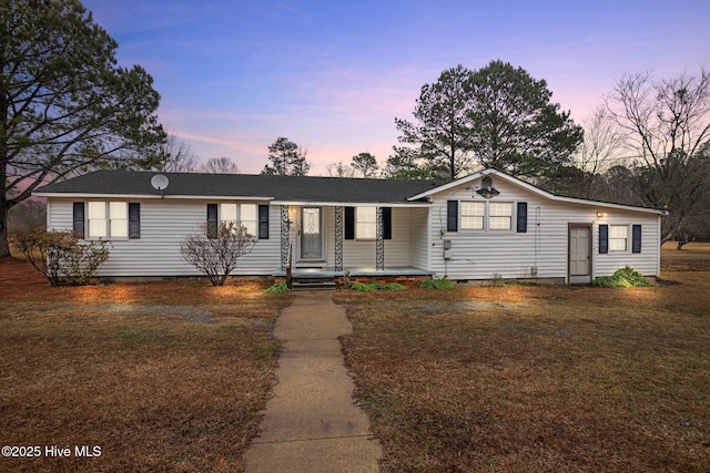 single story home with a porch, crawl space, and a front lawn