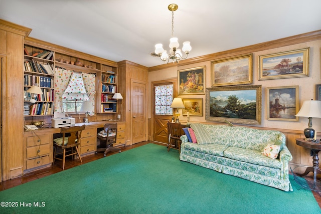 carpeted office space featuring crown molding and a chandelier